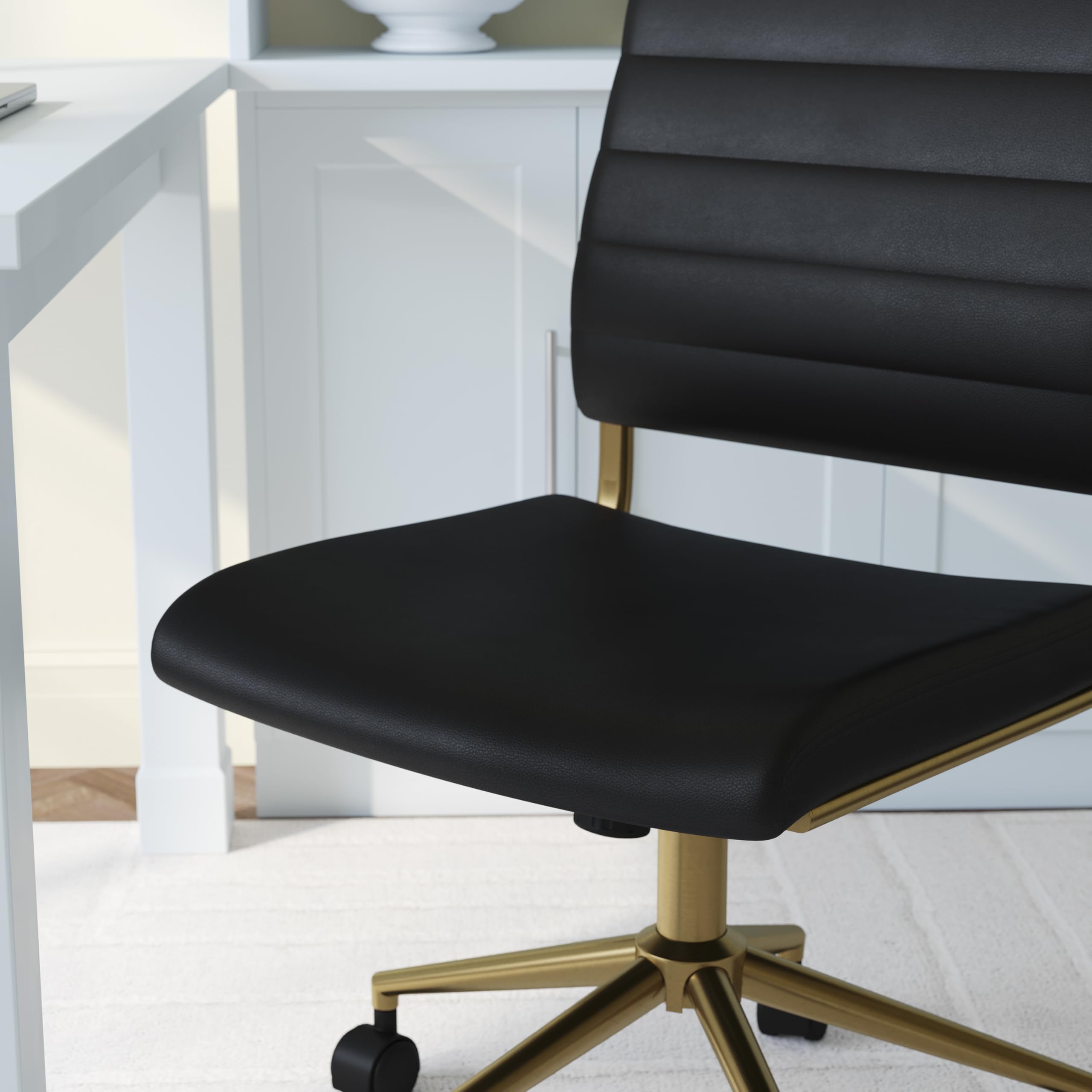 Armless Swivel Task Chair for Home Office in Black Faux Leather with Polished Brass Frame
